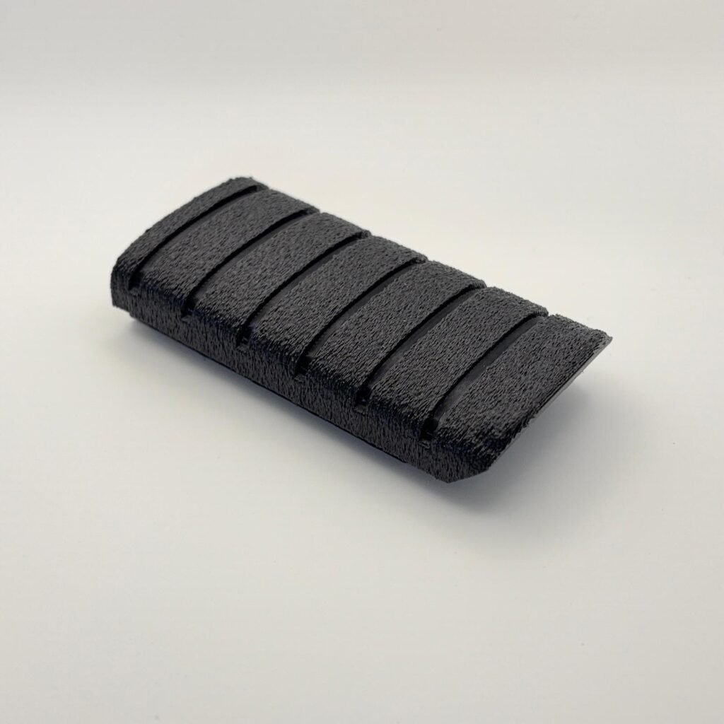Finished Tiger Forge Designs replacement Triumph T2080227 footrest rubber manufactured in black TPU 95A with engineered grip texture.